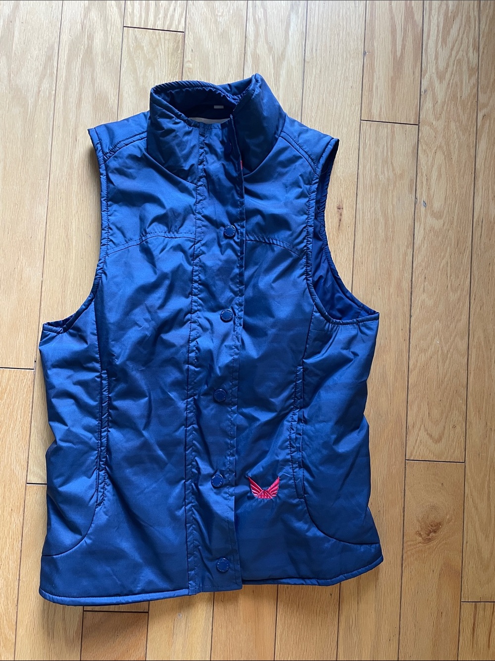 Women’s Navy Quilted Puffer Vest with red logo